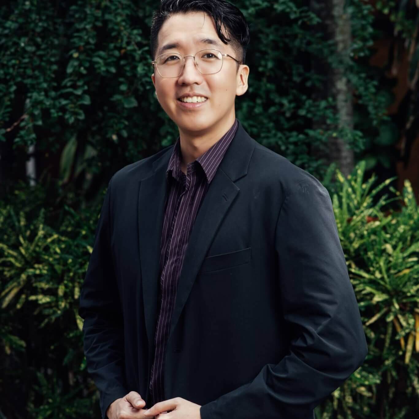 Philipp Chen Tan, Founder and Senior Psychologist of Inner Peace PH, pictured smiling confidently, representing leadership and expertise in mental health services.